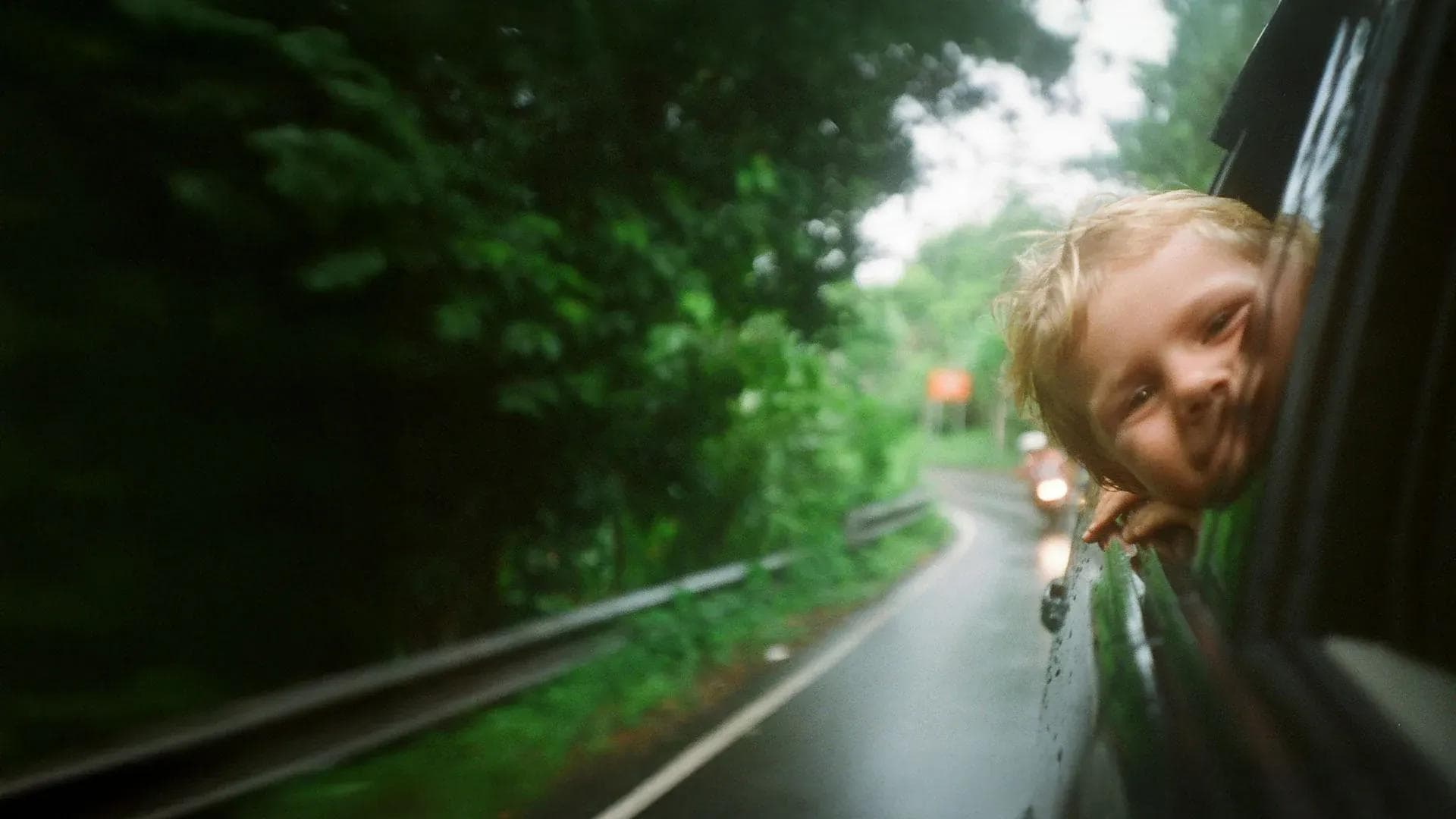 Child in a car, on the road